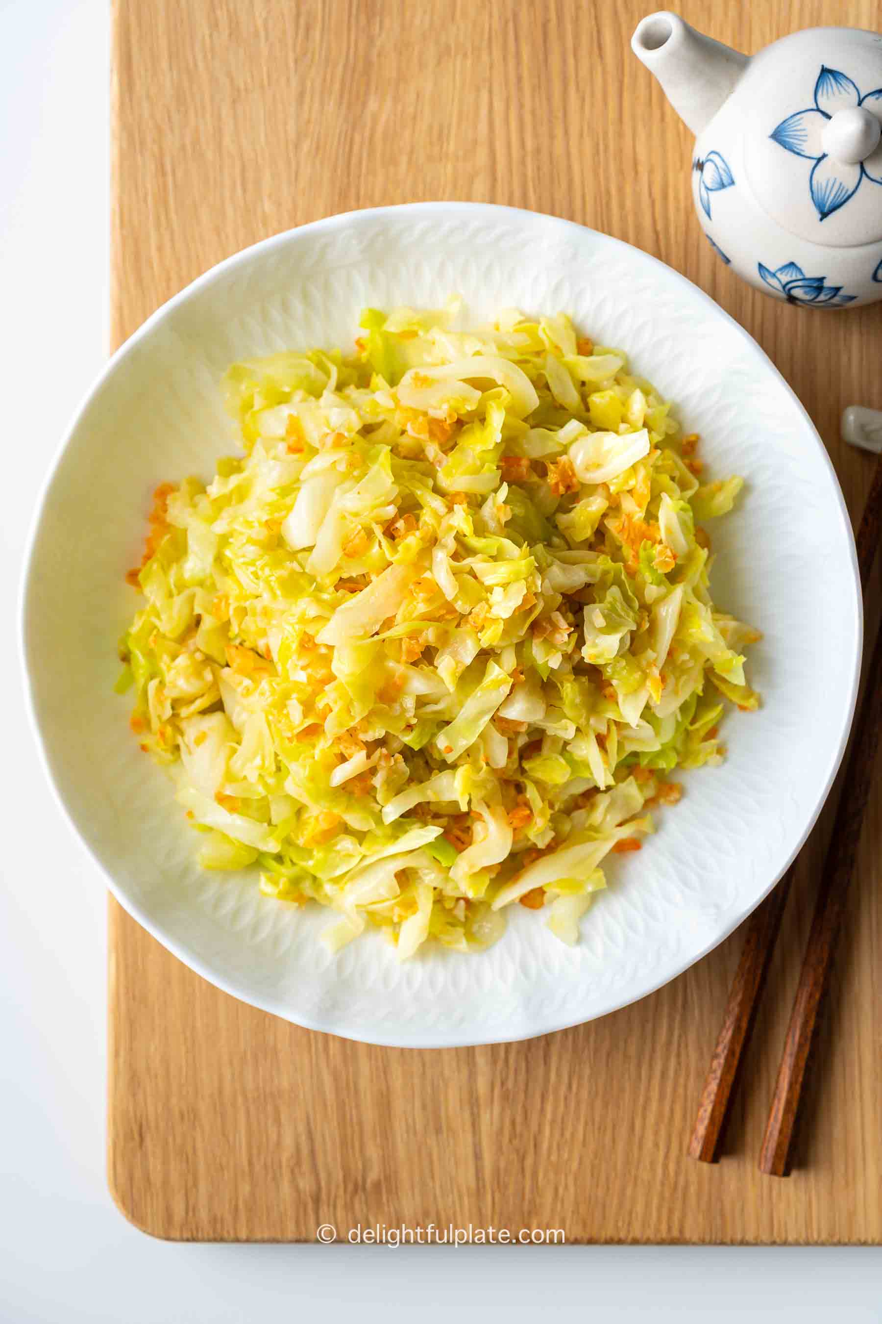 a plate of stir-fried cabbage with dried shrimp.