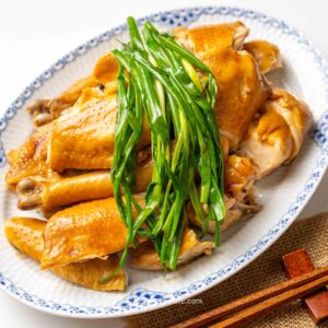 a plate of Vietnamese Steamed Chicken with Fish Sauce and Scallions (Ga Hap Mam Nhi).