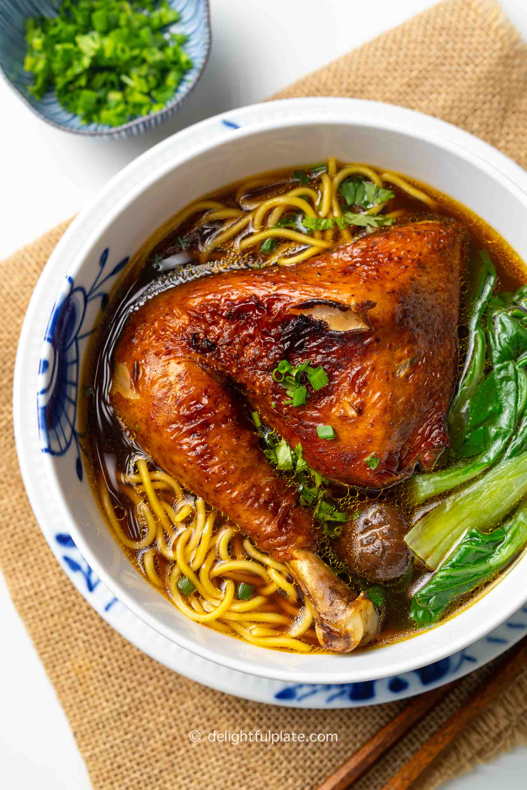 a bowl of mi ga tiem (Vietnamese herbal chicken noodle soup).